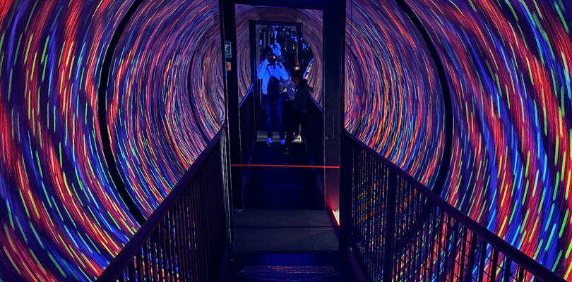 The vortex tunnel from Camera Obscura. There is a bridge and a big blur of different colours on the walls.